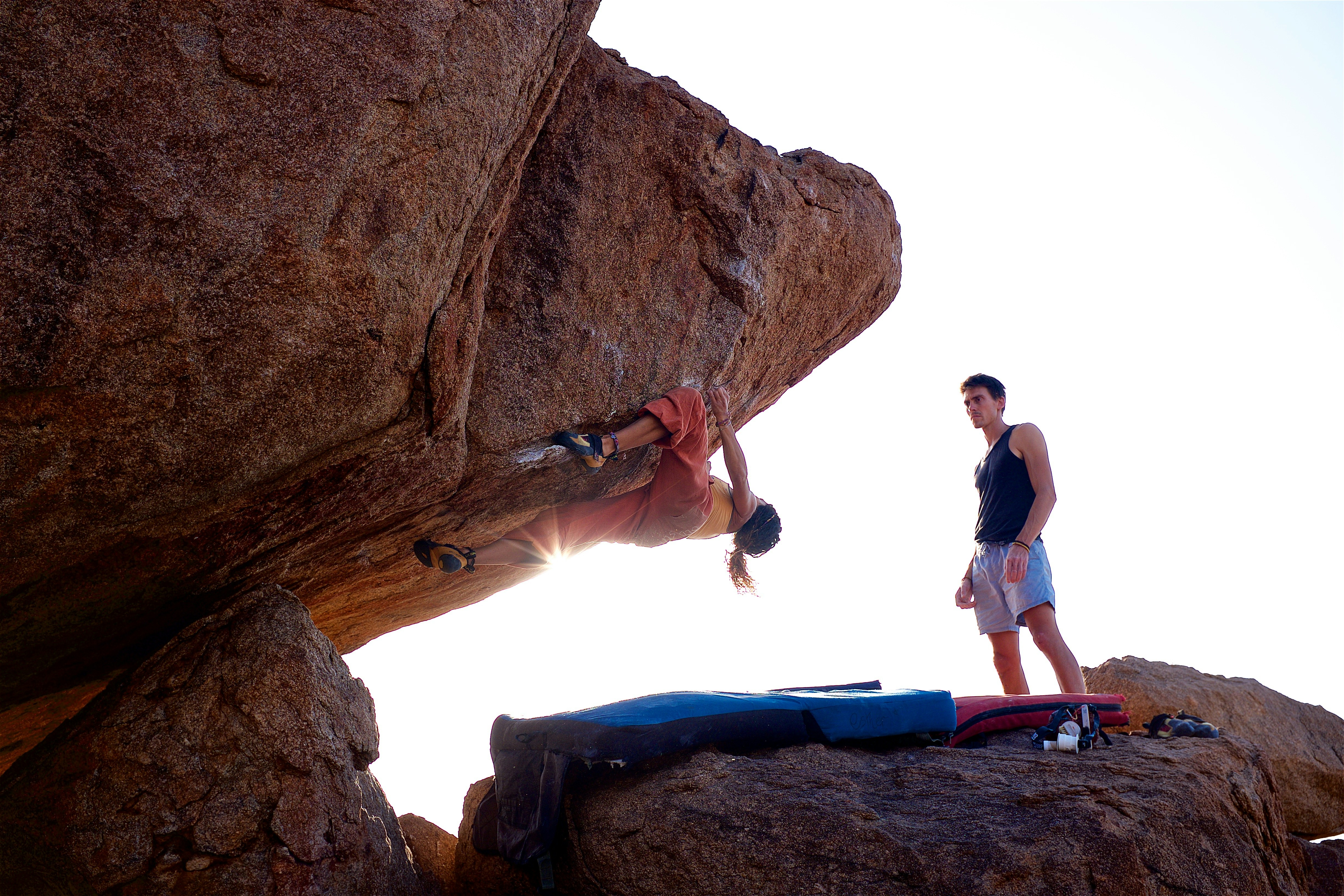 a climber on a bouldering wall