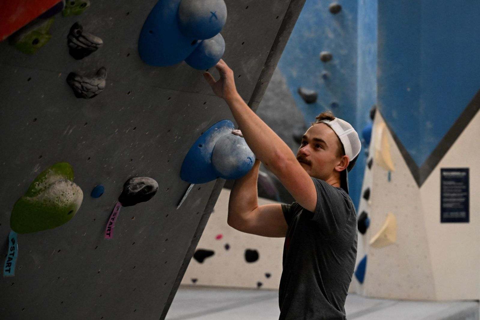 a person about to start climbing a wall with slopers